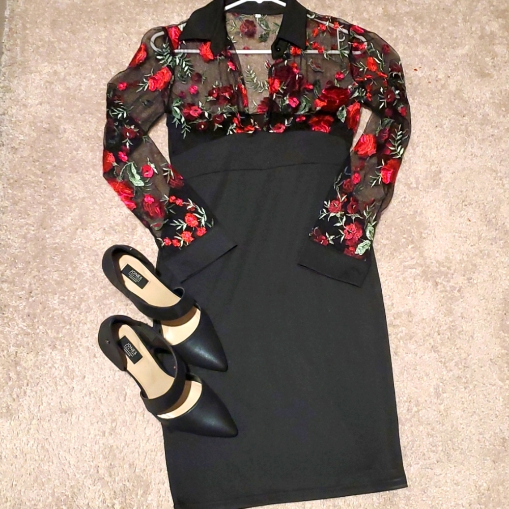 A beautiful little black dress with embroidered red flowers on the top. Size 4